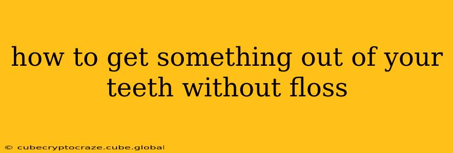 how to get something out of your teeth without floss